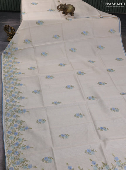 Kota silk saree beige and pastel blue with embroidery work and floral embroidery corcia lace border