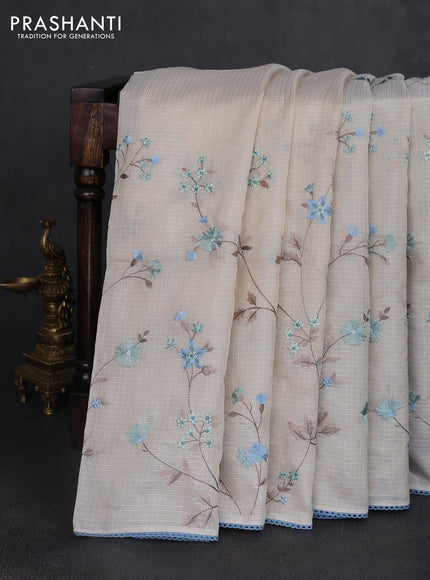 Kota silk saree beige and pastel blue with allover embroidery work and crocia lace border