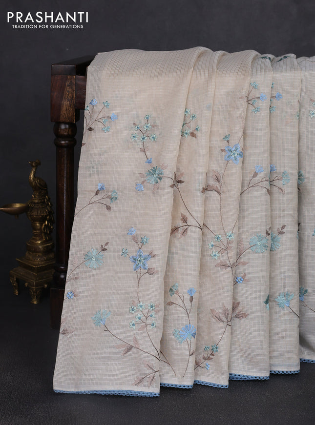 Kota silk saree beige and pastel blue with allover embroidery work and crocia lace border