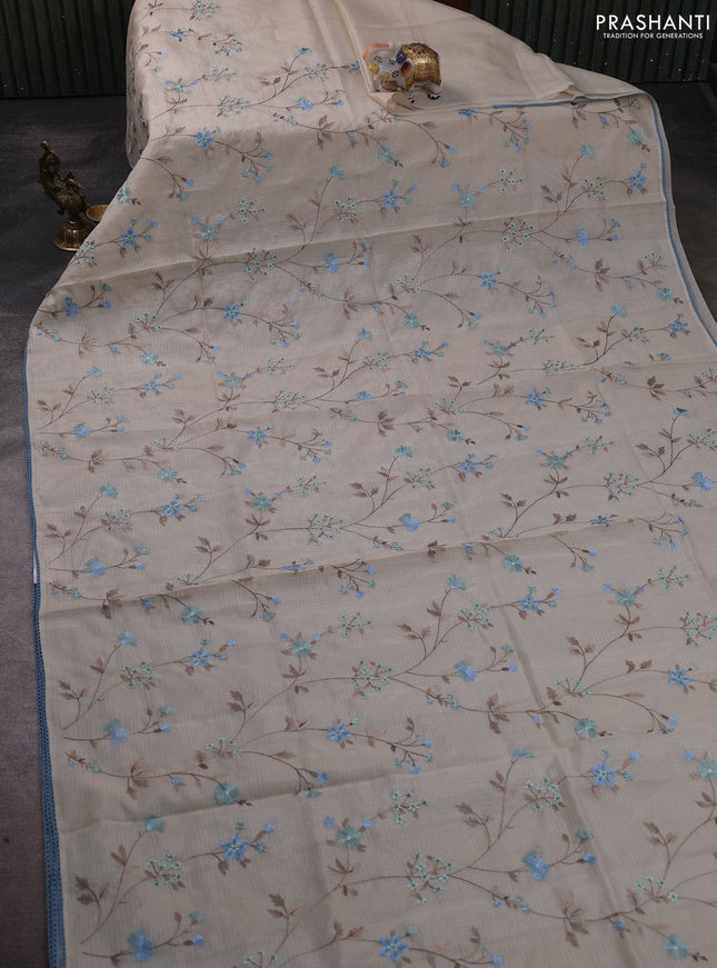 Kota silk saree beige and pastel blue with allover embroidery work and crocia lace border