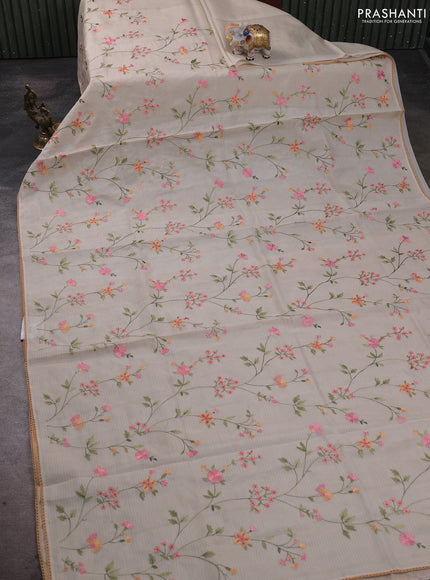 Kota silk saree beige and pale orange with allover embroidery work and crocia lace border