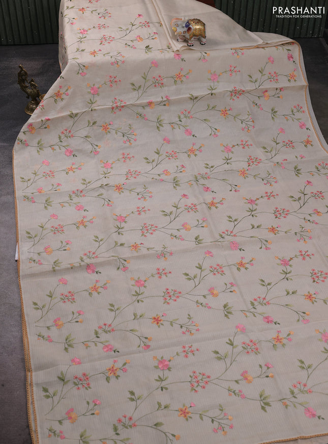 Kota silk saree beige and pale orange with allover embroidery work and crocia lace border