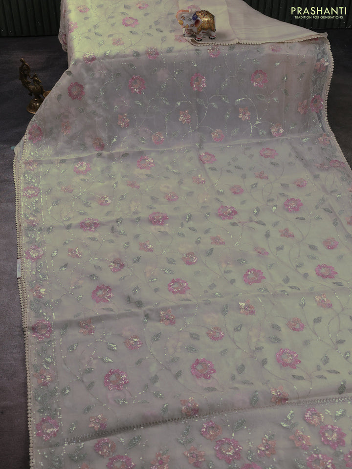 Pure organza silk saree beige with allover embroidery sequin work and embroidery crocia lace work border