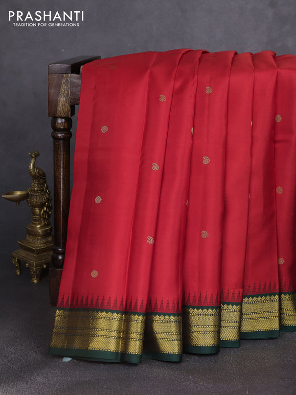 Pure kanchipuram silk saree red and bottle green with zari woven buttas and temple design zari woven korvai border