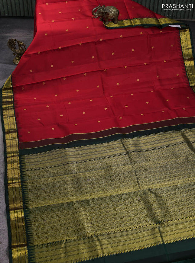 Pure kanchipuram silk saree red and bottle green with zari woven buttas and temple design zari woven korvai border