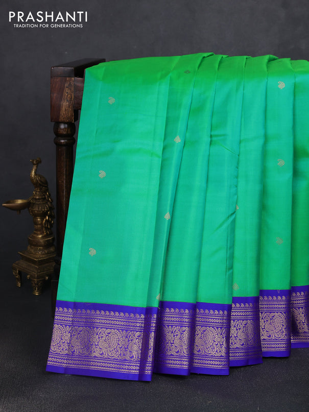 Pure kanchipuram silk saree dual shade of teal green and royal blue with zari woven buttas and rich zari woven korvai border
