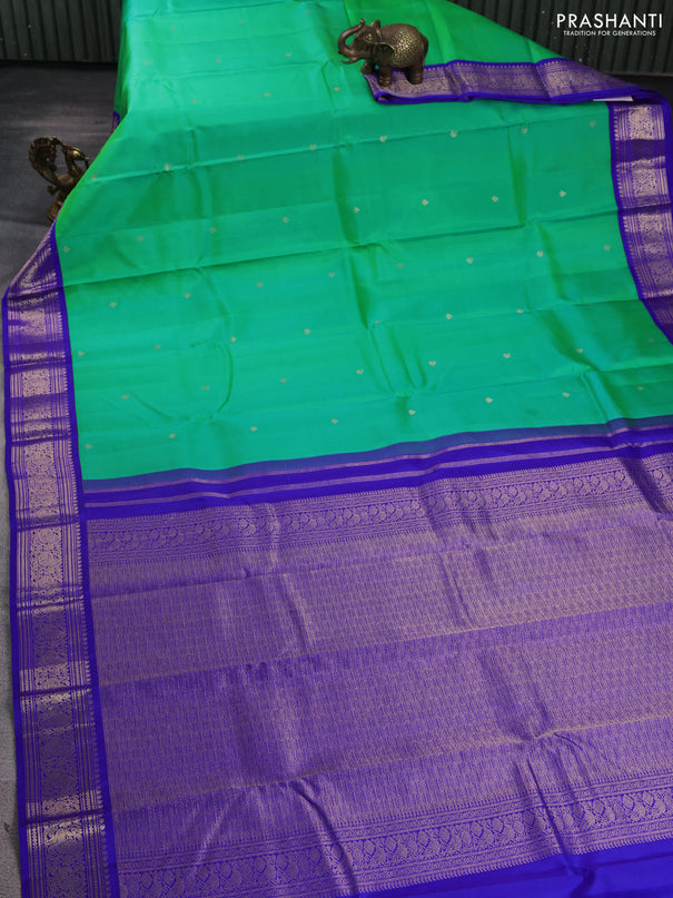 Pure kanchipuram silk saree dual shade of teal green and royal blue with zari woven buttas and rich zari woven korvai border
