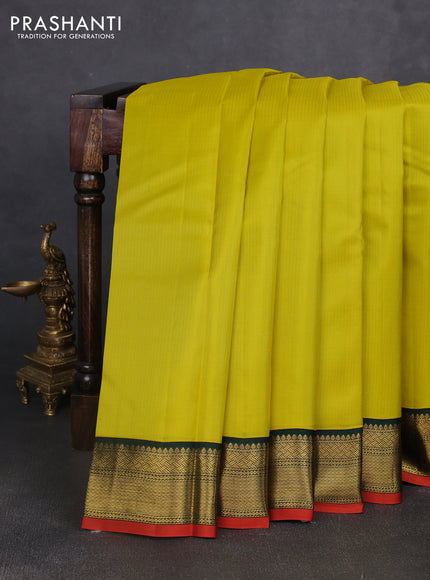 Pure kanchipuram silk saree lime yellow and bottle green with allover zari stripe pattern and rich zari woven korvai border