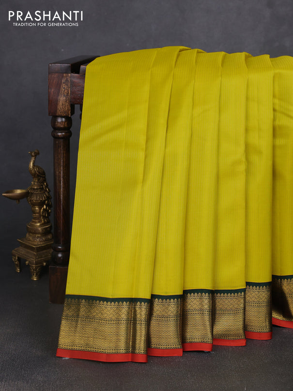 Pure kanchipuram silk saree lime yellow and bottle green with allover zari stripe pattern and rich zari woven korvai border