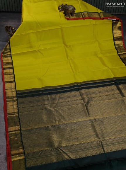 Pure kanchipuram silk saree lime yellow and bottle green with allover zari stripe pattern and rich zari woven korvai border