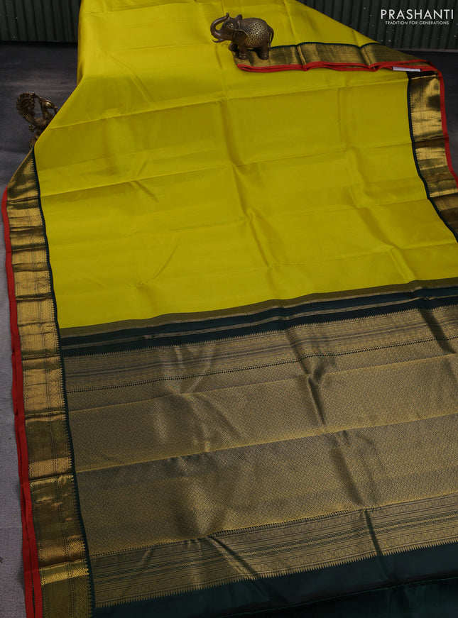 Pure kanchipuram silk saree lime yellow and bottle green with allover zari stripe pattern and rich zari woven korvai border