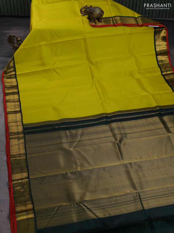 Pure kanchipuram silk saree lime yellow and bottle green with allover zari stripe pattern and rich zari woven korvai border