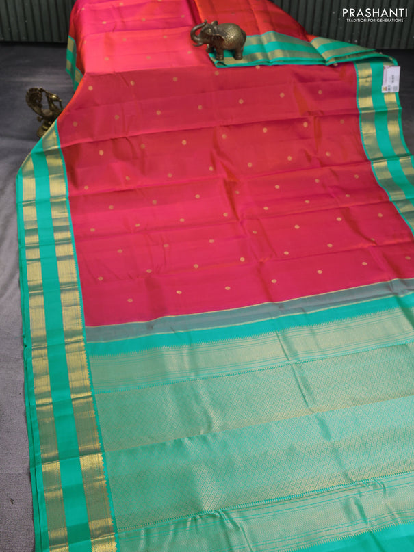 Pure kanchipuram silk saree dual shade of pinkish orange and teal blue with zari woven buttas and rettapet zari woven korvai border