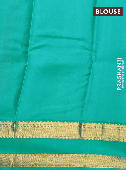 Pure kanchipuram silk saree dual shade of pinkish orange and teal blue with zari woven buttas and rettapet zari woven korvai border