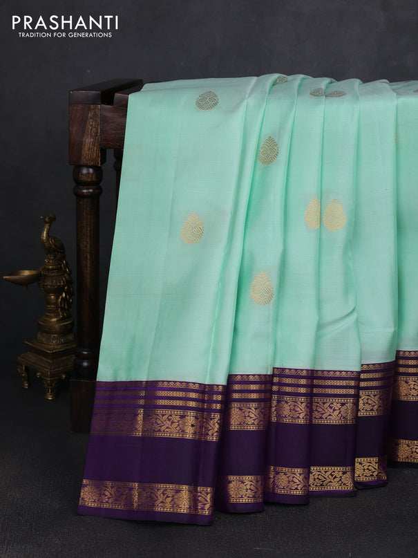 Pure kanchipuram silk saree pastel green shade and purple with zari woven buttas and rettapet zari woven korvai border
