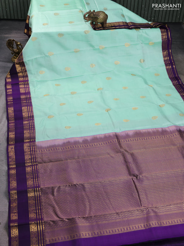 Pure kanchipuram silk saree pastel green shade and purple with zari woven buttas and rettapet zari woven korvai border