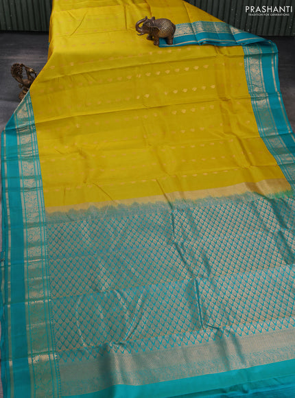 Pure kanchipuram silk saree lime yellow and teal blue with allover zari woven buttas and rettapet zari woven korvai border