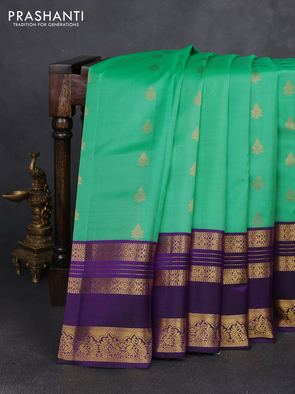 Pure kanchipuram silk saree teal green shade and violet with zari woven buttas and long zari woven korvai border