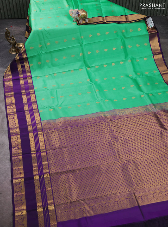 Pure kanchipuram silk saree teal green shade and violet with zari woven buttas and long zari woven korvai border