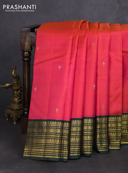 Pure kanchipuram silk saree dual shade of pinkish orange and bottle green with zari woven buttas and zari woven korvai border