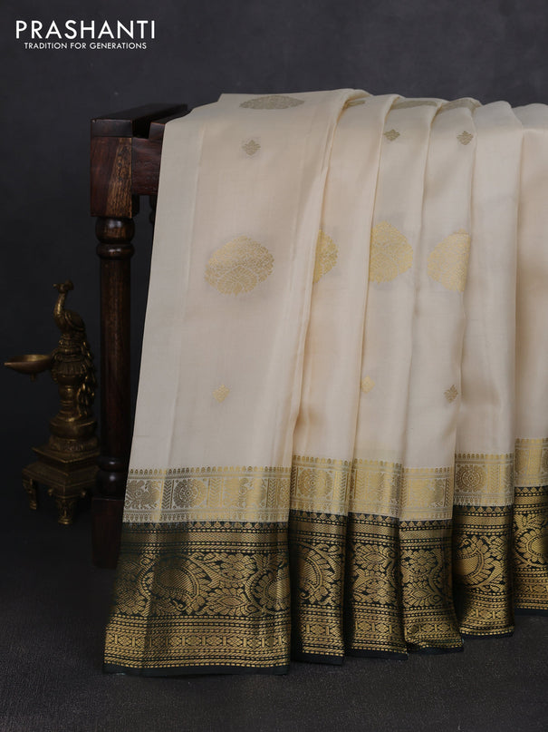 Pure kanchipuram silk saree cream and bottle green with zari woven buttas and long zari woven korvai border