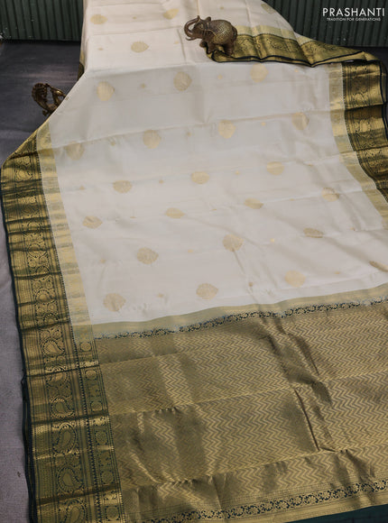 Pure kanchipuram silk saree cream and bottle green with zari woven buttas and long zari woven korvai border