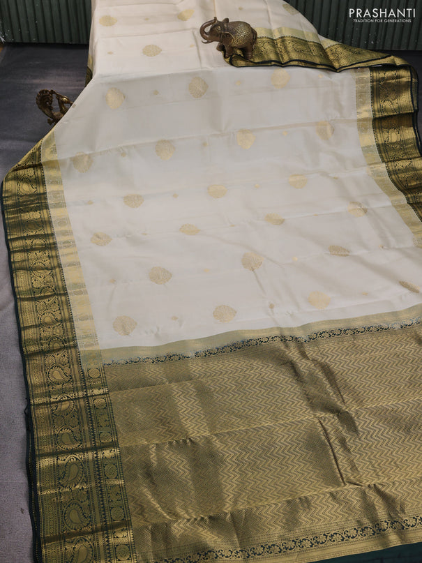 Pure kanchipuram silk saree cream and bottle green with zari woven buttas and long zari woven korvai border