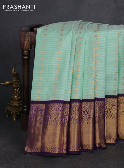 Pure kanchipuram silk saree mild teal green and purple with allover zari stripe & buttas and long zari woven korvai border