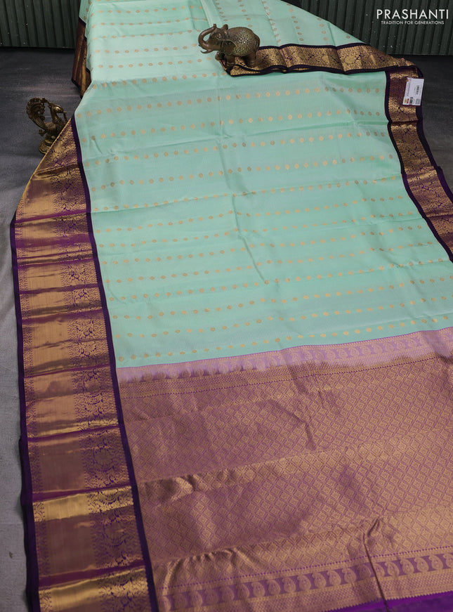 Pure kanchipuram silk saree mild teal green and purple with allover zari stripe & buttas and long zari woven korvai border
