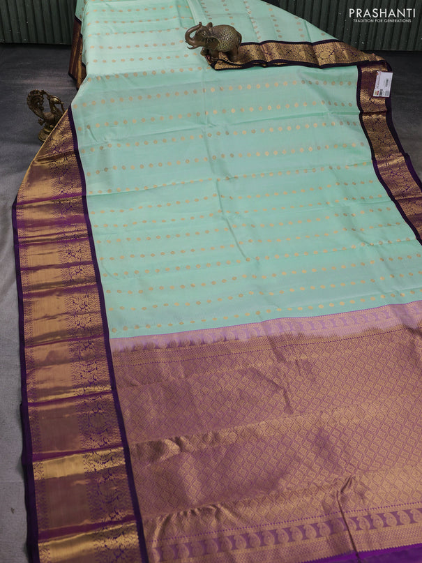 Pure kanchipuram silk saree mild teal green and purple with allover zari stripe & buttas and long zari woven korvai border