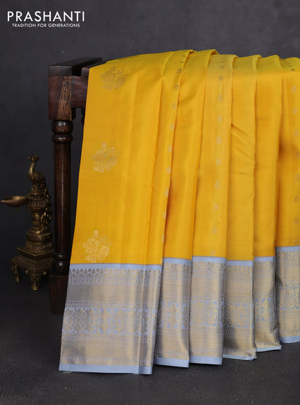 Pure kanchipuram silk saree yellow and grey with zari woven buttas and zari woven korvai border