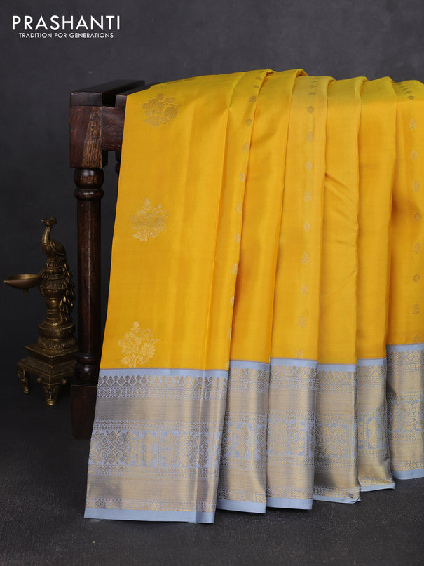 Pure kanchipuram silk saree yellow and grey with zari woven buttas and zari woven korvai border