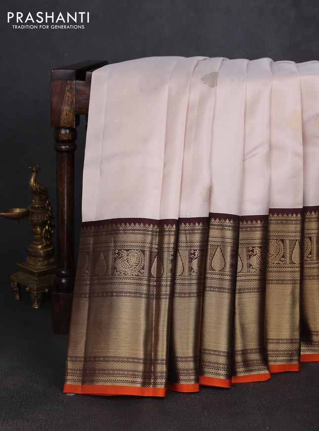 Pure kanchipuram silk saree cream and coffee brown with zari woven buttas and long zari woven korvai border