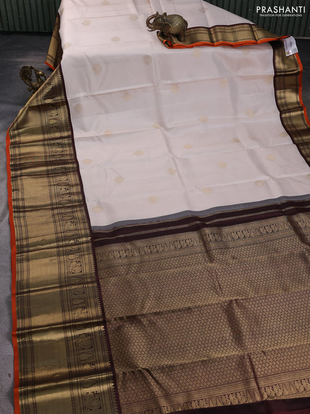 Pure kanchipuram silk saree cream and coffee brown with zari woven buttas and long zari woven korvai border