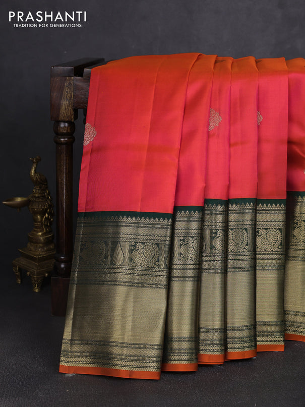 Pure kanchipuram silk saree dual shade of pinkish orange and bottle green with zari woven buttas and long zari woven korvai border