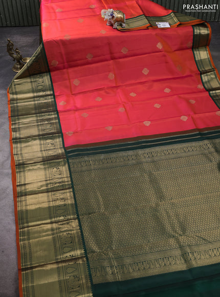 Pure kanchipuram silk saree dual shade of pinkish orange and bottle green with zari woven buttas and long zari woven korvai border