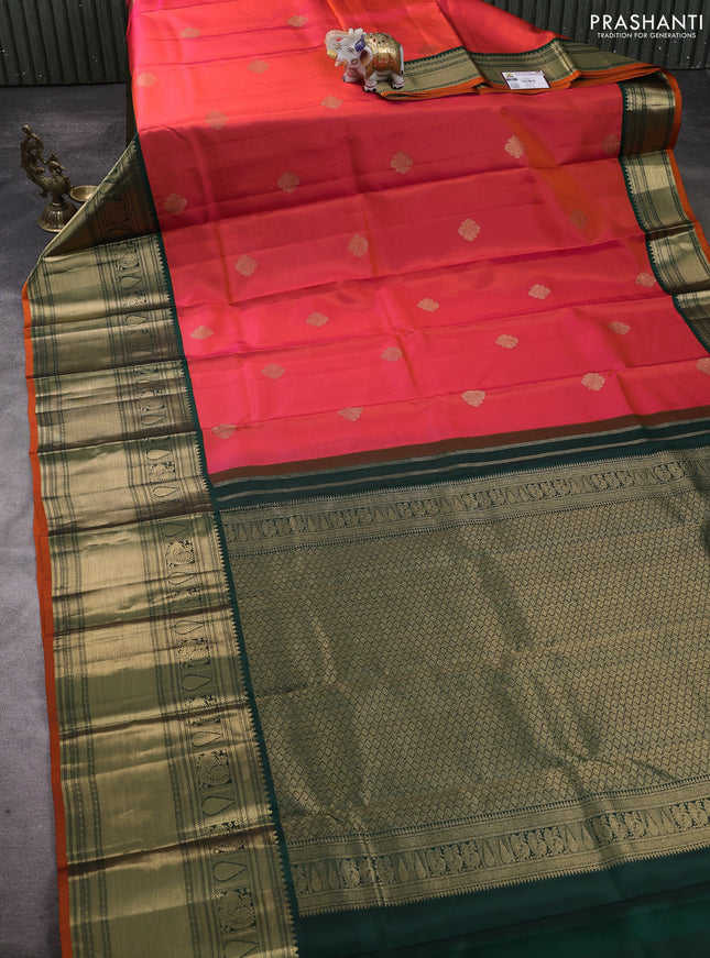 Pure kanchipuram silk saree dual shade of pinkish orange and bottle green with zari woven buttas and long zari woven korvai border