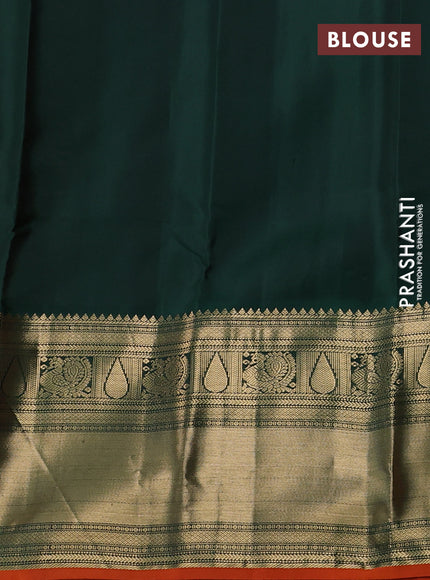 Pure kanchipuram silk saree dual shade of pinkish orange and bottle green with zari woven buttas and long zari woven korvai border