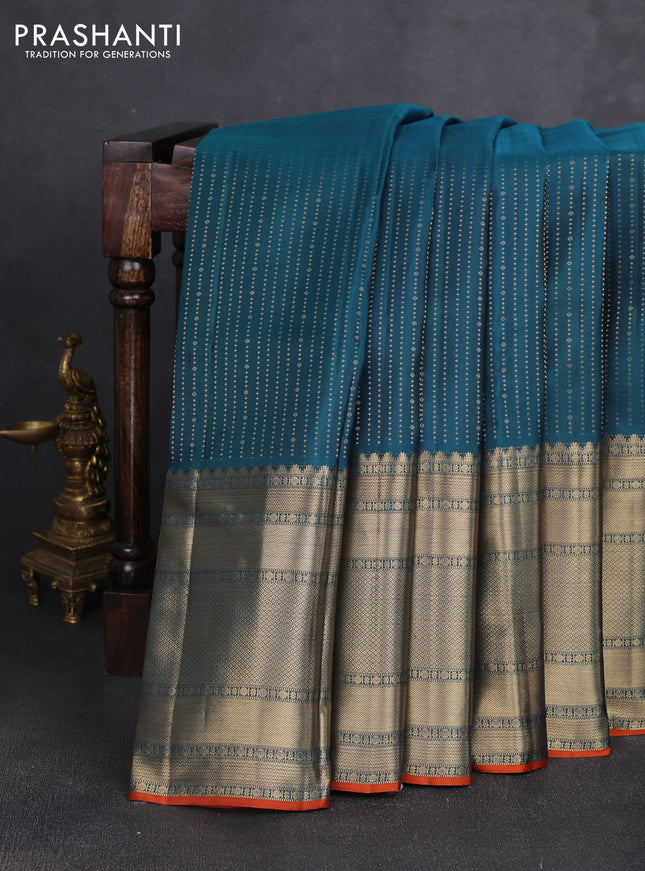 Pure kanchipuram silk saree peacock blue and orange with allover zari weaves and long zari woven border