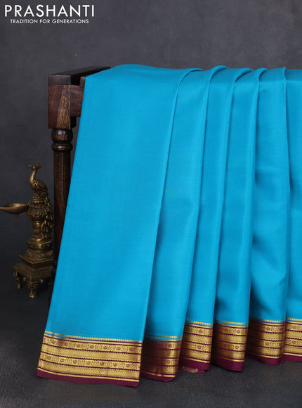 Pure mysore silk saree teal blue and wine shade with plain body and zari woven border