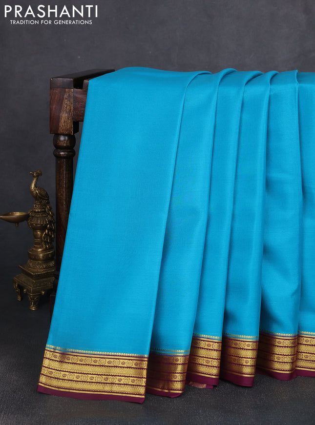 Pure mysore silk saree teal blue and wine shade with plain body and zari woven border