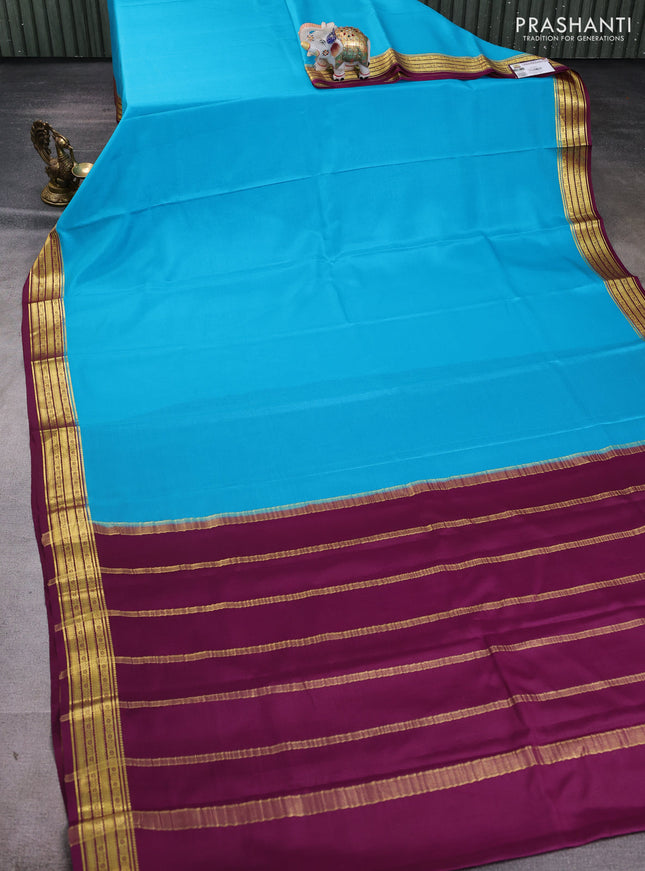 Pure mysore silk saree teal blue and wine shade with plain body and zari woven border