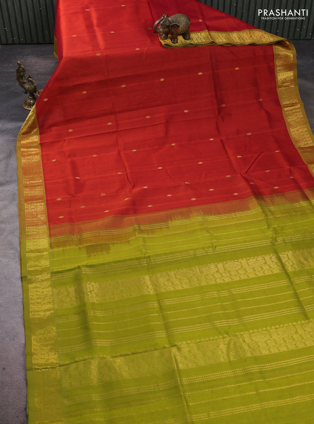 Silk cotton saree rustic orange and light green with zari woven buttas and zari woven border