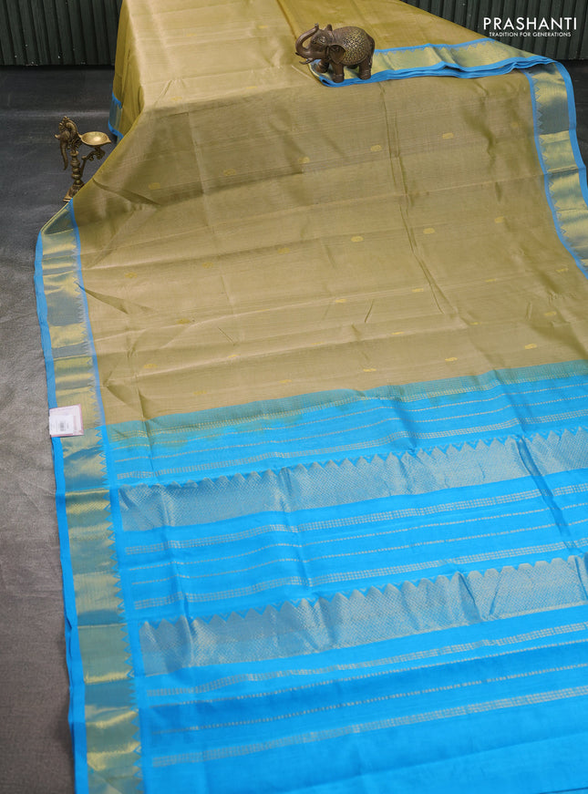 Silk cotton saree elachi green and cs blue with paisley zari woven buttas and temple design zari woven border