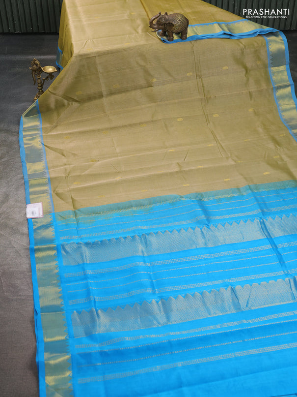 Silk cotton saree elachi green and cs blue with paisley zari woven buttas and temple design zari woven border