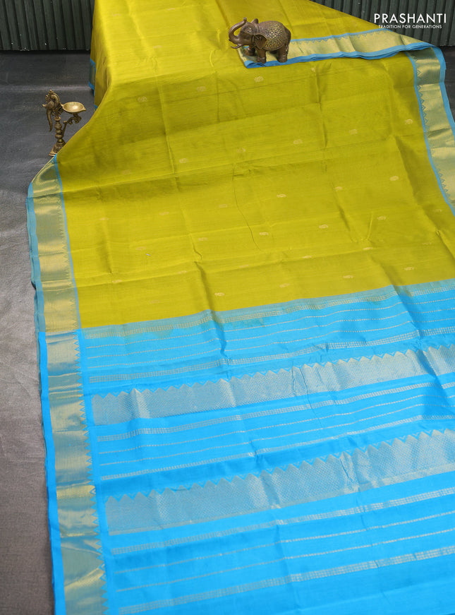 Silk cotton saree lime green and cs blue with paisley zari woven buttas and temple design zari woven border
