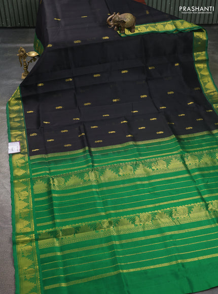 Silk cotton saree black and green with paisley zari woven buttas and temple & annam zari woven border