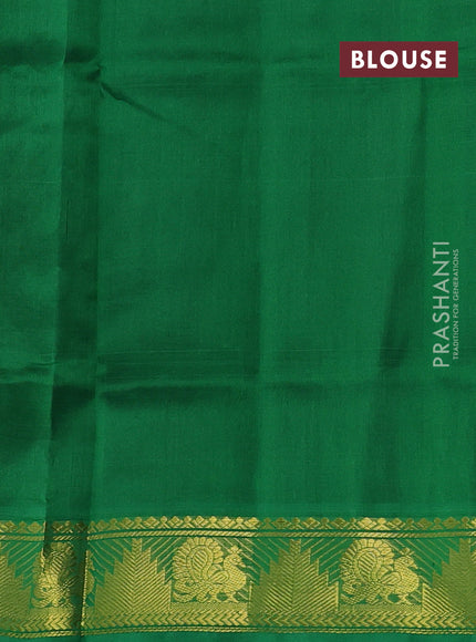 Silk cotton saree black and green with paisley zari woven buttas and temple & annam zari woven border