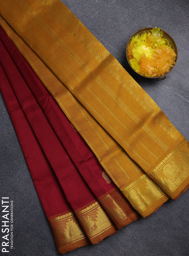 Silk cotton saree maroon and mustard yellow with paisley zari woven buttas and temple & annam zari woven border