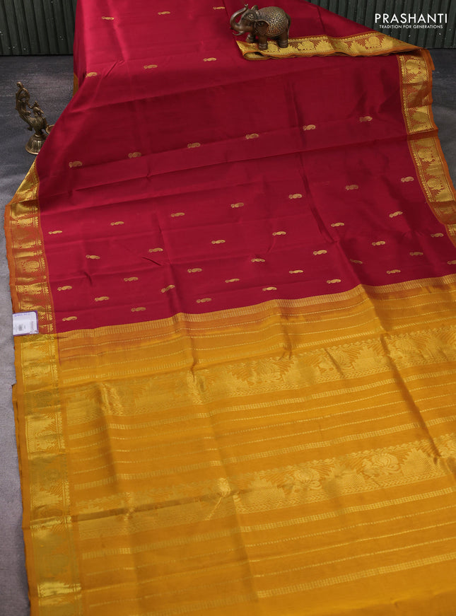 Silk cotton saree maroon and mustard yellow with paisley zari woven buttas and temple & annam zari woven border